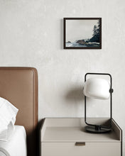 Load image into Gallery viewer, Framed original oil landscape painting above a nightstand with a lamp in a bedroom setting
