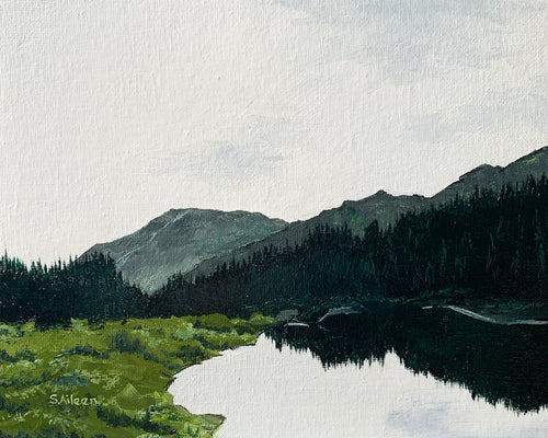 Original 8x10 oil painting of a moody landscape with a light sky, still lake, dark pine reflections, distant hills, and a grassy meadow.