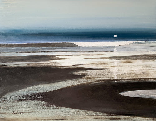 A serene nocturne of the Pacific coast, where the low moon rises gently over glistening sands. A distant wave crests as water flows quietly along the shore, capturing the calm and subtle motion of the night tide.