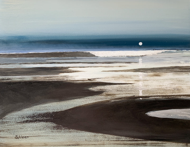 A serene nocturne of the Pacific coast, where the low moon rises gently over glistening sands. A distant wave crests as water flows quietly along the shore, capturing the calm and subtle motion of the night tide.