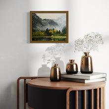 Load image into Gallery viewer, Oil painting of a calm lake bordered by tall pine trees and a rocky shoreline, with soft fog draping distant hills. Gentle light suggests early morning, evoking a quiet sense of awakening in nature.
